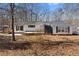 Charming single-story home with white siding, black shutters and a well-manicured front yard at 4941 N Helton Rd, Winston, GA 30187
