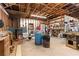 Large garage area featuring a wood-burning stove, workbench, and storage, perfect for projects and organization at 4941 N Helton Rd, Winston, GA 30187
