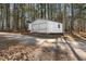 Detached two-car garage in a wooded setting, providing ample parking and storage space at 4941 N Helton Rd, Winston, GA 30187