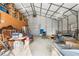 Large garage interior with high ceilings, storage shelves, and ample space for multiple vehicles or equipment at 4941 N Helton Rd, Winston, GA 30187
