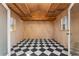 Finished interior with black and white checkered floors and a vaulted ceiling for a unique and stylish space at 4941 N Helton Rd, Winston, GA 30187