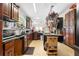 Spacious kitchen featuring dark wood cabinets, granite counters, and modern appliances at 4941 N Helton Rd, Winston, GA 30187