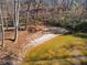 A lakeside area with sandy shore and a view of a serene lake setting at 4941 N Helton Rd, Winston, GA 30187