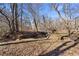 A charming bridge crossing a small ravine on a spacious parcel of land at 4941 N Helton Rd, Winston, GA 30187