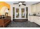 Slate tiled sun room featuring french doors at 4941 N Helton Rd, Winston, GA 30187