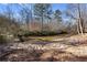 A picturesque river runs through the property, framed by lush trees at 4941 N Helton Rd, Winston, GA 30187