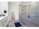 Bright bathroom showcasing a walk-in shower with modern fixtures and bench seating at 779 Keystone Dr, Woodstock, GA 30188