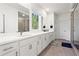 Bright bathroom featuring double vanity with modern fixtures and large window at 779 Keystone Dr, Woodstock, GA 30188