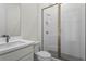 Modern bathroom featuring a glass shower with white subway tile and gray flooring and white vanity with solid surface countertops at 779 Keystone Dr, Woodstock, GA 30188