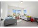Shared bedroom with two beds, lots of light, and a view of the neighborhood at 779 Keystone Dr, Woodstock, GA 30188