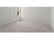 Bedroom featuring carpet floors, neutral walls, and a window providing natural light at 779 Keystone Dr, Woodstock, GA 30188