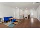 Open bonus room with hardwood floors, stair access, and lots of natural light at 779 Keystone Dr, Woodstock, GA 30188