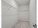 Walk-in closet with white walls and wire shelving provides ample storage space at 779 Keystone Dr, Woodstock, GA 30188