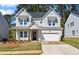 Charming two-story home with a well-manicured lawn, grey brick, and inviting curb appeal at 779 Keystone Dr, Woodstock, GA 30188