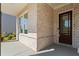 Inviting entrance featuring a modern door with a sleek design and textured brick facade at 779 Keystone Dr, Woodstock, GA 30188