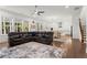 Open-concept living room with hardwood floors, bright windows, and a spacious seating area at 779 Keystone Dr, Woodstock, GA 30188