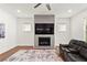 Living room showcases a fireplace, large TV, and comfortable seating at 779 Keystone Dr, Woodstock, GA 30188