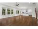 Spacious open concept with hardwood floors seamlessly connecting the living room to kitchen at 779 Keystone Dr, Woodstock, GA 30188