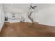 Expansive living area with hardwood floors, opening to the modern kitchen and staircase at 779 Keystone Dr, Woodstock, GA 30188