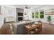 Modern living room with large windows, fireplace, and contemporary furnishings at 779 Keystone Dr, Woodstock, GA 30188