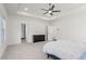 Spacious bedroom featuring a trey ceiling with fan and modern black dresser at 779 Keystone Dr, Woodstock, GA 30188