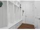 A well-organized mudroom with lockers, built-in benches, and storage cubbies for coats and shoes at 779 Keystone Dr, Woodstock, GA 30188