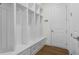 Well-organized mudroom with custom built-in shelving, drawers, and bench seating for added storage and convenience at 779 Keystone Dr, Woodstock, GA 30188