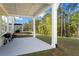 Relaxing covered patio with outdoor grill, ideal for entertaining and enjoying the private backyard at 779 Keystone Dr, Woodstock, GA 30188
