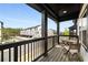 Charming balcony featuring a table and chairs, overlooking a serene neighborhood at 1008 Knoxboro Ln, Woodstock, GA 30188