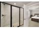 Modern bathroom features a glass shower with marble tile at 1008 Knoxboro Ln, Woodstock, GA 30188