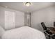 Minimalist bedroom with white bedding, a full bed, a work desk, and neutral carpeting at 1008 Knoxboro Ln, Woodstock, GA 30188