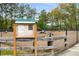 Community dog park with fenced-in area for furry friends to play and socialize at 1008 Knoxboro Ln, Woodstock, GA 30188