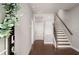 Modern entryway featuring hardwood floors, a staircase, and a view into other rooms at 1008 Knoxboro Ln, Woodstock, GA 30188