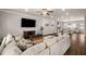 Spacious living room with an open floor plan that leads to the kitchen and dining area at 1008 Knoxboro Ln, Woodstock, GA 30188