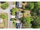 Aerial view of the house, showing roof, landscaping, and surrounding neighborhood at 1755 Pinetree Pass Sw Ln, Lilburn, GA 30047