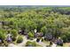 Beautiful aerial view of a neighborhood with mature trees and well-maintained homes at 1755 Pinetree Pass Sw Ln, Lilburn, GA 30047