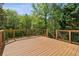 Large wooden back deck overlooking a serene, wooded area at 1755 Pinetree Pass Sw Ln, Lilburn, GA 30047