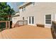 Spacious back deck features a wooden bench and backyard views at 1755 Pinetree Pass Sw Ln, Lilburn, GA 30047