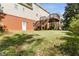 Sprawling backyard with a multi-level deck and lush green grass at 1755 Pinetree Pass Sw Ln, Lilburn, GA 30047
