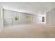 Large basement area with plush carpeting, recessed lighting, and windows allowing natural light at 1755 Pinetree Pass Sw Ln, Lilburn, GA 30047