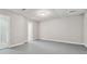 Unfinished basement space with painted walls, painted floors, and basic lighting at 1755 Pinetree Pass Sw Ln, Lilburn, GA 30047