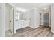 Bathroom featuring dual vanity sinks and modern lighting at 1755 Pinetree Pass Sw Ln, Lilburn, GA 30047