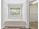 This bathroom has a soaking tub and a walk-in closet at 1755 Pinetree Pass Sw Ln, Lilburn, GA 30047