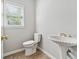 Powder room with a pedestal sink at 1755 Pinetree Pass Sw Ln, Lilburn, GA 30047