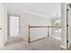Hallway with carpet flooring at 1755 Pinetree Pass Sw Ln, Lilburn, GA 30047