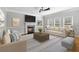 Living room featuring fireplace, ceiling fan and neutral decor at 1755 Pinetree Pass Sw Ln, Lilburn, GA 30047