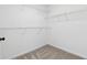 This walk-in closet has carpet and white wire shelving at 1755 Pinetree Pass Sw Ln, Lilburn, GA 30047