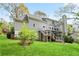 Two story home with backyard featuring a deck and stairs, lush green lawn at 4086 Norton Se Pl, Smyrna, GA 30082