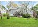 Spacious backyard featuring a lush green lawn and mature trees at 4086 Norton Se Pl, Smyrna, GA 30082