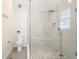Shower features pebble floor and stone tile, with glass door and wall-mounted shower head at 4086 Norton Se Pl, Smyrna, GA 30082